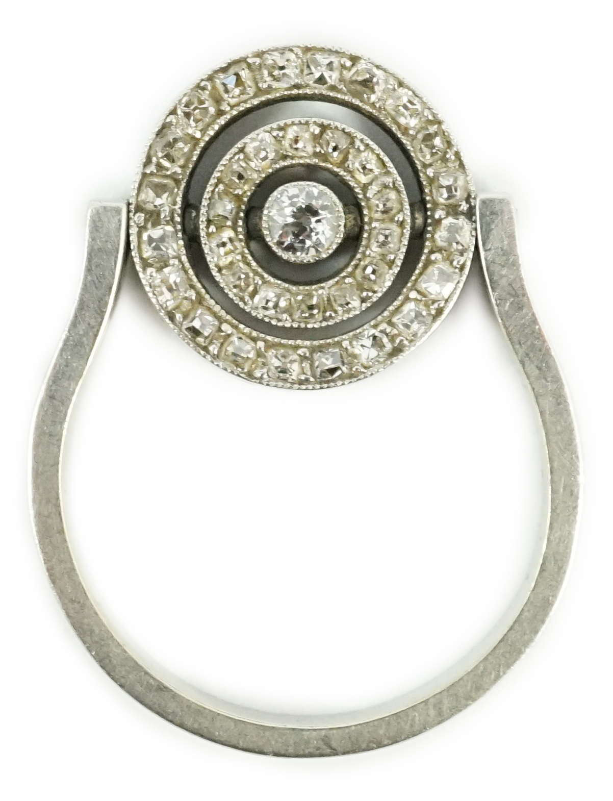 A platinum?, ruby and diamond cluster set swivelling target ring